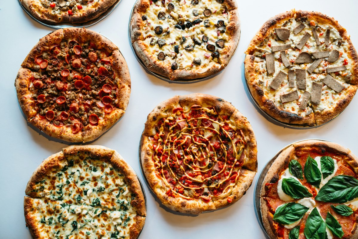 Freshly baked pizzas with a variety of toppings